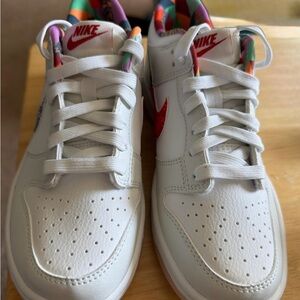 Nike White Low-Top Sneakers with Red Swoosh and Multicolor Lining